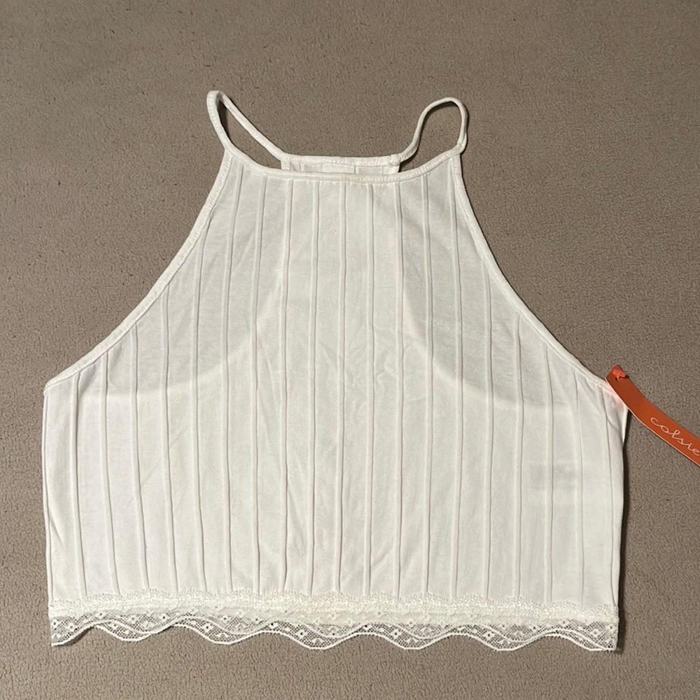 Colsie brand cropped racer back rubbed tank with lace detailing.